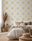 Peel and stick wallpaper featuring a geometric star tile design in white and gold