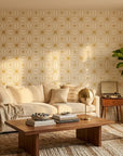 Starlight Geometry gold geometric star wallpaper in a warm and inviting living room