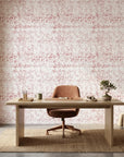 Static Field red abstract peel and stick wallpaper as a feature wall in a bright home office