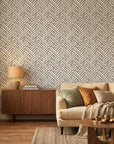 Still Labyrinth grey geometric peel and stick wallpaper in a warm and inviting living room