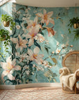 Still & White floral wallpaper with peach lilies and cherry blossoms on turquoise background in sunlit room
