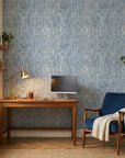 Storm Weave blue and grey abstract wallpaper as a feature wall in a bright home office