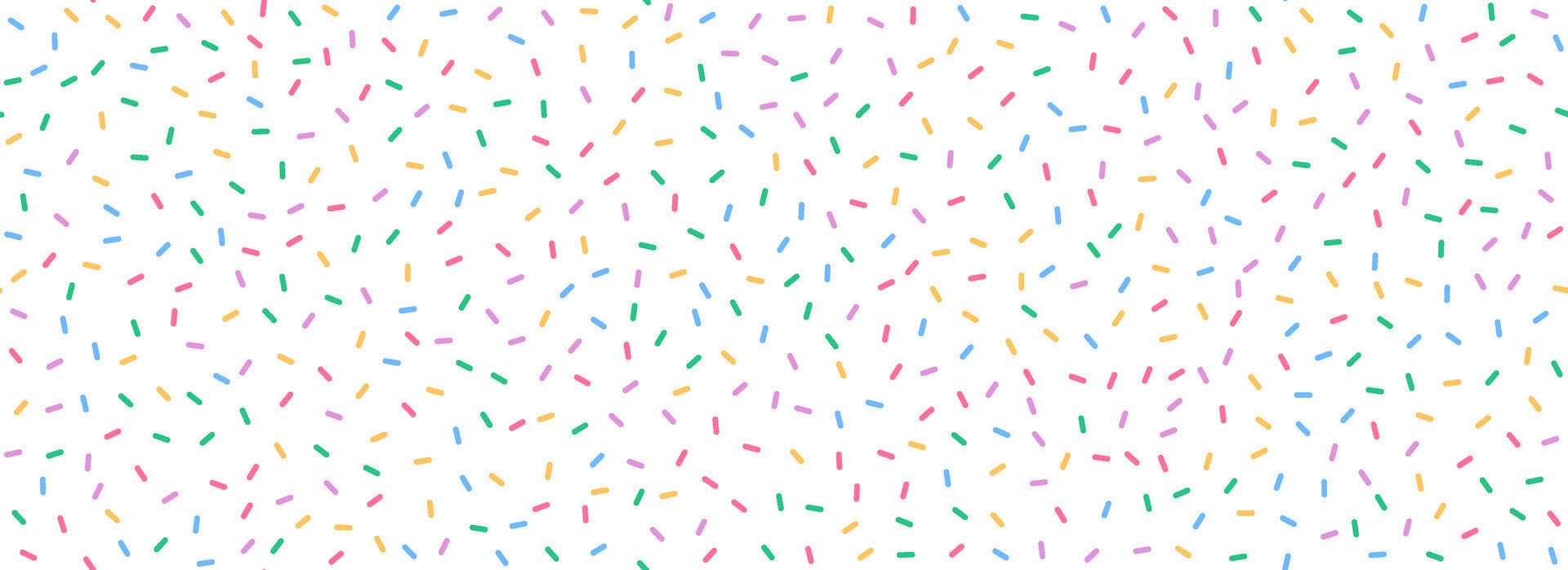 This fun, white wallpaper features brightly colored dots and dashes (sprinkles) widely distributed for a festive appearance