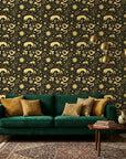 Sun & Moon gold and black celestial wallpaper in a warm and inviting living room