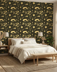 Sun & Moon gold and black celestial wallpaper adding character to a cozy bedroom