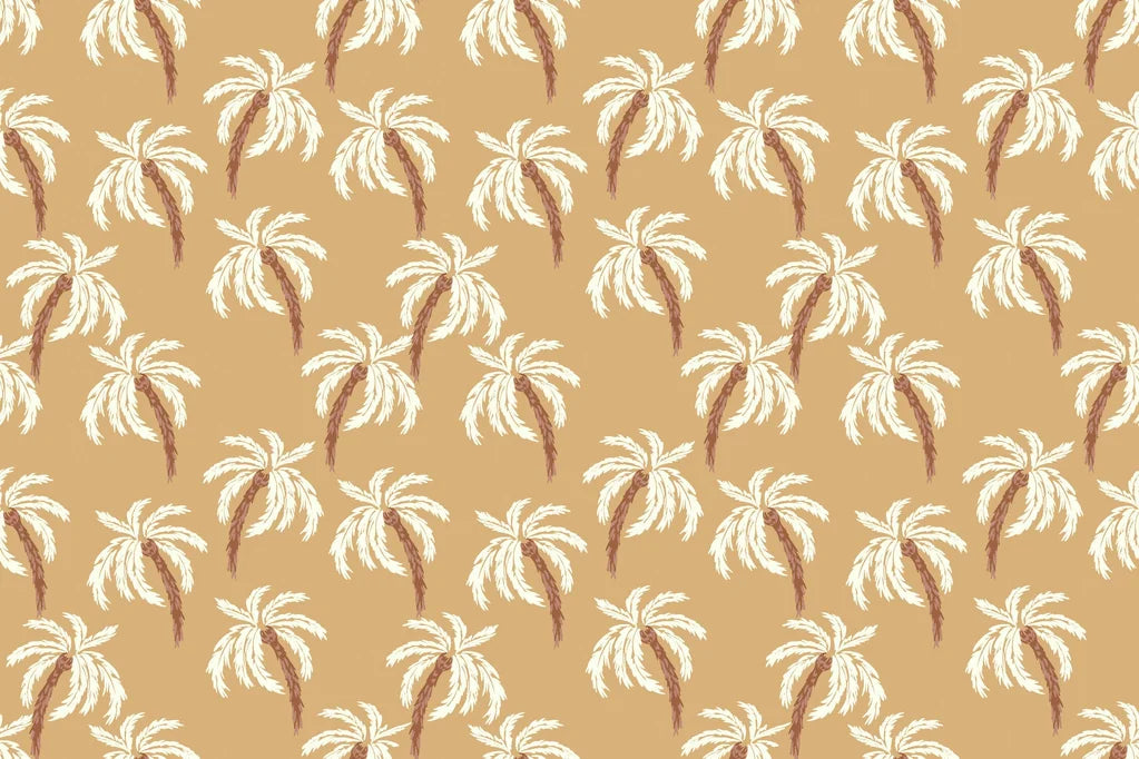 A beige wall covering patterned with white and brown tropical palm trees, named Sun Whispers.