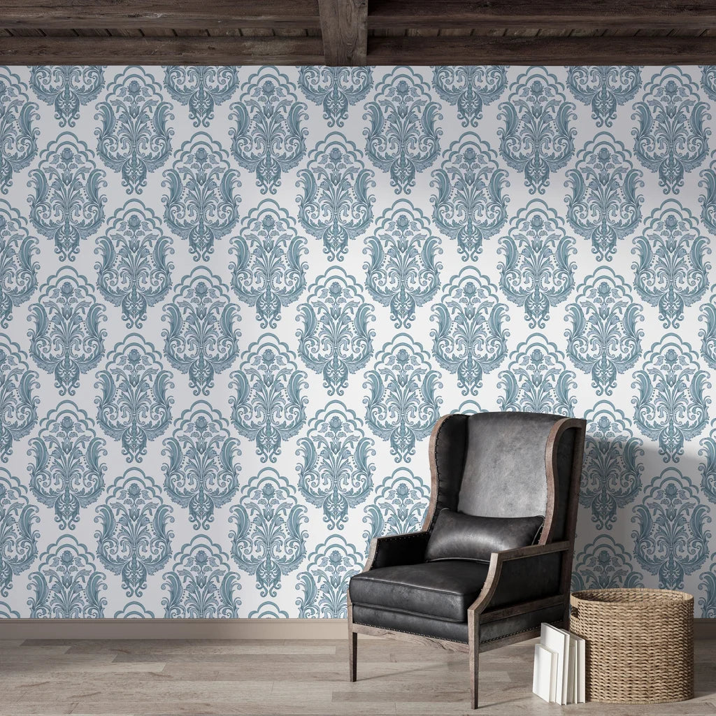 Sunlit Thicket damask wallpaper in blue and cream tones on rustic living room feature wall