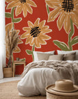 A terracotta-colored wall covering with a hand-drawn yellow sunflower motif - Sunset Scribbles