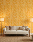 Tawny Rain golden brushstroke dash wallpaper in a warm and inviting living room