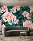 Tender Hours removable wallpaper with pink peonies and teal tropical leaves on living room accent wall