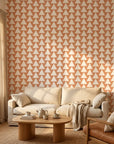 Terracotta Peaks geometric peach triangle wallpaper in a warm and inviting living room