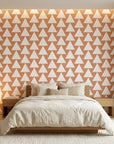 Terracotta Peaks geometric peach triangle wallpaper adding character to a cozy bedroom