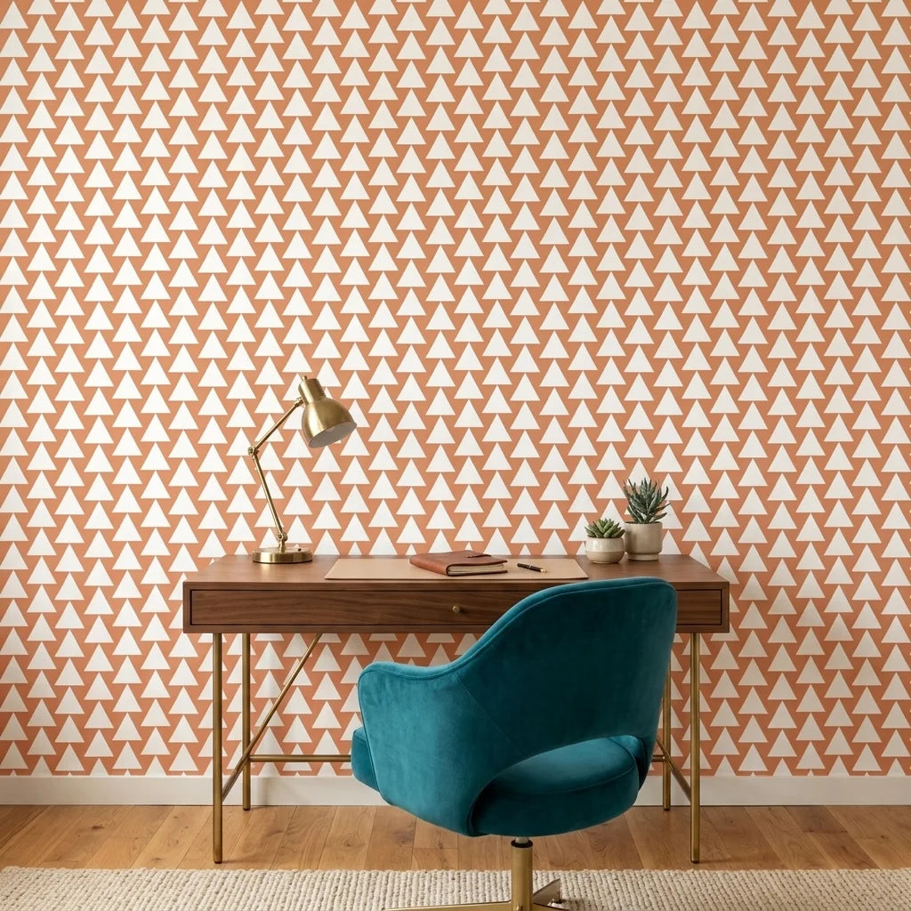 Terracotta Peaks geometric peach triangle wallpaper as a feature wall in a bright home office
