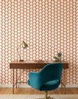 Terracotta Peaks geometric peach triangle wallpaper as a feature wall in a bright home office