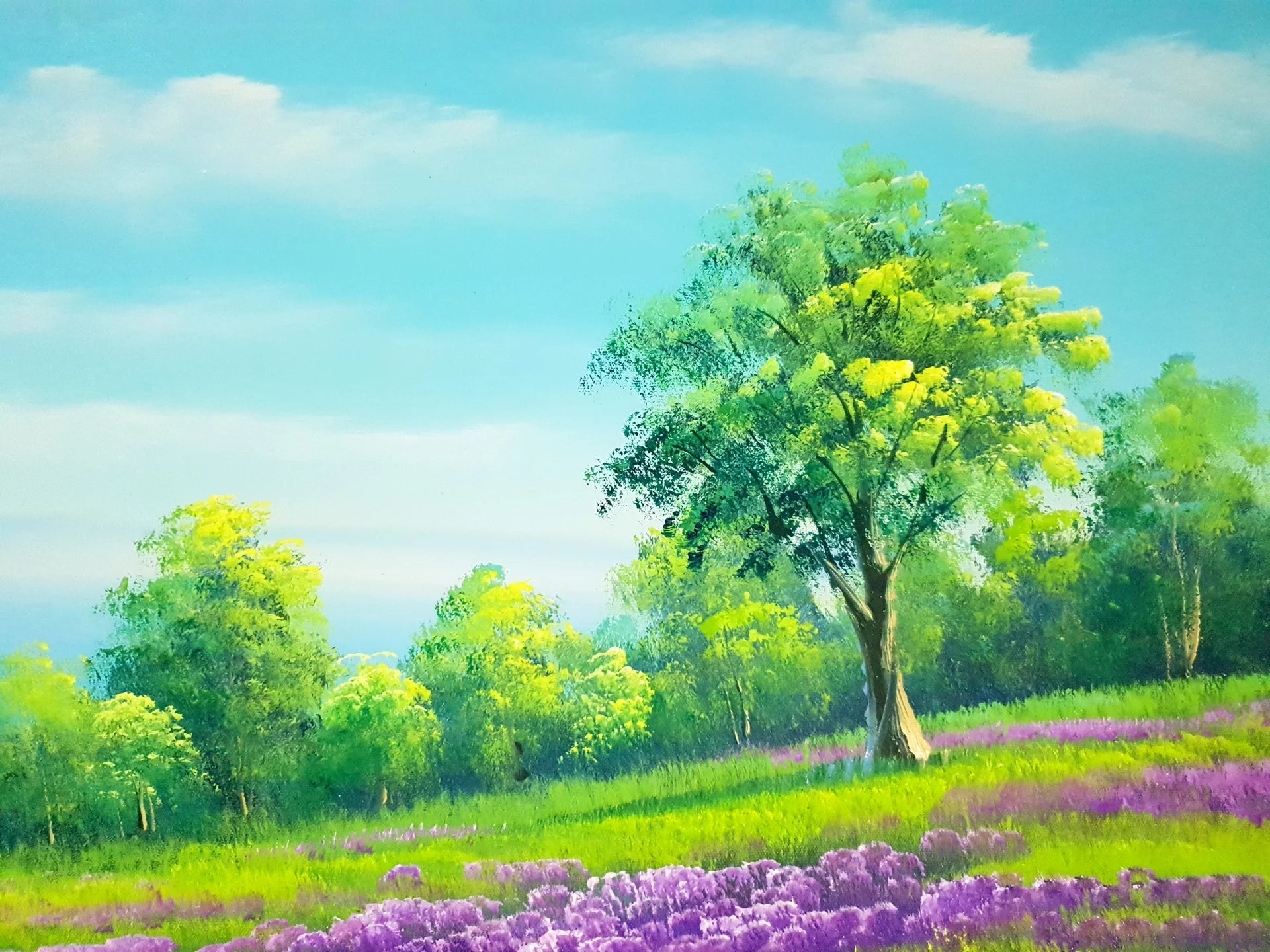 The Lilac Season lavender meadow and green tree landscape wallpaper creating ambiance in a serene bathroom