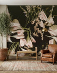 The Still Hour oversized floral wallpaper with blush tulips on dark background in elegant living room