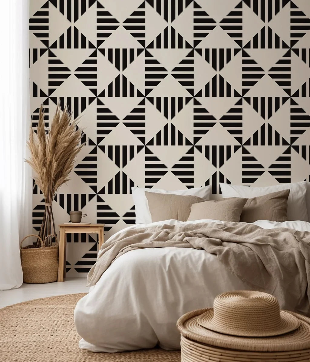 Ticking Wings peel and stick wallpaper featuring a black and white geometric triangle stripe pattern