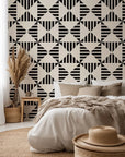 Ticking Wings peel and stick wallpaper featuring a black and white geometric triangle stripe pattern