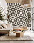Monochromatic wall covering featuring a geometric striped design with triangular shapes, labeled Ticking Wings