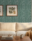 Tidal Grain green vertical woodgrain wallpaper in a warm and inviting living room