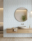 Tide Garden blue botanical peel and stick wallpaper creating ambiance in a serene bathroom