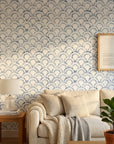 Tide's Armor blue geometric peel and stick wallpaper in a warm and inviting living room