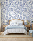 Toucan Toile blue and white tropical bird wallpaper adding character to a cozy bedroom