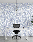 Toucan Toile blue and white tropical bird wallpaper as a feature wall in a bright home office