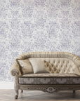 Lavender and cream Tranquil Flora damask wallpaper in elegant living room with tufted sofa