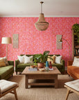 Tropic Flame bold pink and orange tropical wallpaper in a warm and inviting living room