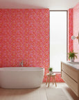Tropic Flame bold pink and orange tropical wallpaper creating ambiance in a serene bathroom