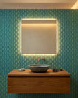 Tropical Prism bold blue and teal geometric wallpaper as a feature wall in a bright home office