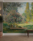 Impressionist garden mural wallpaper featuring pink flowering trees and golden willows in Turquoise Blossoms design