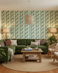 Urchin Tide coastal teal and sage shell wallpaper in a warm and inviting living room