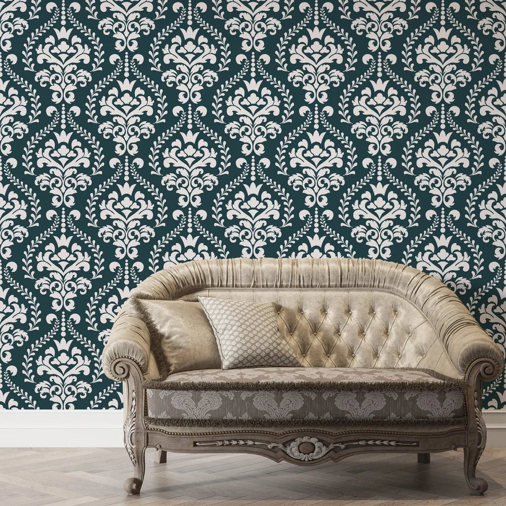 Dark teal and cream Veiled Botany damask wallpaper behind vintage tufted sofa in elegant living room
