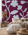 Deep red wall covering with pale blue flower outlines, available as self-adhesive paper, titled Velvet Bloom