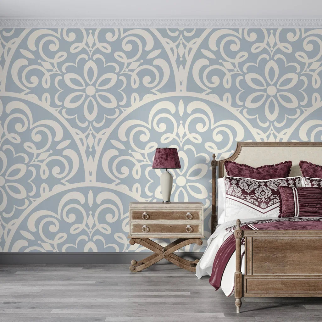 Slate blue and cream Velvet Vine Serenade damask wallpaper on bedroom accent wall with ornate scrollwork pattern