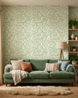 Smooth sage green leaf sprig botanical peel and stick wallpaper - Verdant Canopy in a warm living room