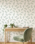 Textured scattered green leaf botanical sprig peel and stick wallpaper - Verdant Scatter adding character to a bedroom