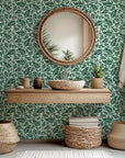 Deep green wall covering displaying a lush, packed motif of tropical foliage, known as Verdant Cascade