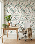 Vermillion Stem teal and red botanical wallpaper as a feature wall in a bright home office