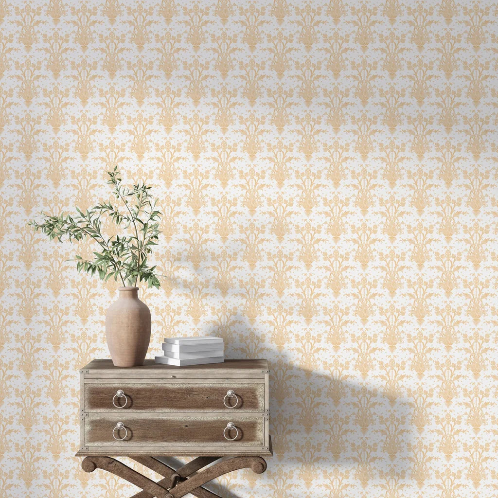 Gold and cream Victorian Petal Dream damask wallpaper in elegant living room setting with vintage furniture