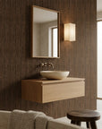 Warm Earth textured brown vertical wallpaper creating ambiance in a serene bathroom