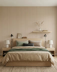 Warm Ticking cozy tan ticking stripe wallpaper adding character to a cozy bedroom