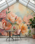 Watercolor Hours removable wallpaper featuring soft pink and peach floral blooms in sunlit conservatory setting