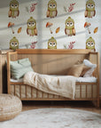 A delightful wall covering with a soft, neutral palette, patterned with winter owls and classic forest motifs.