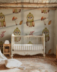 An understated, appealing wallpaper adorned with forest icons and charming cold-weather owls