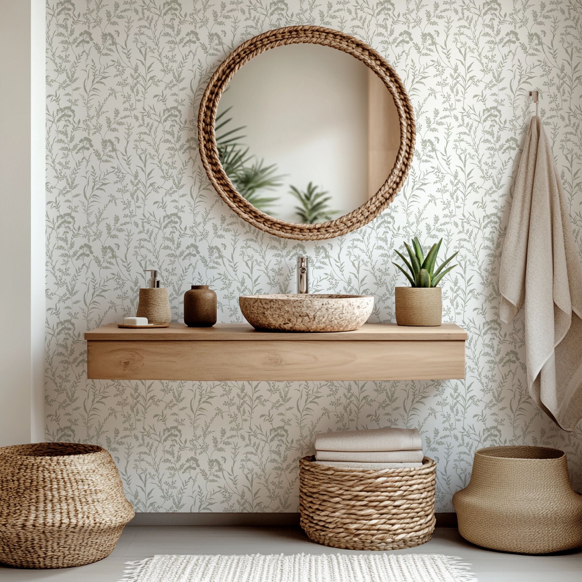 Self-adhesive grey and white wall covering featuring a silhouette pattern of botanical wild blossoms, named 'Whispered Meadows'