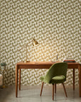 Wild Palm gold botanical peel and stick wallpaper as a feature wall in a bright home office
