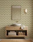 Wild Palm gold botanical peel and stick wallpaper creating ambiance in a serene bathroom